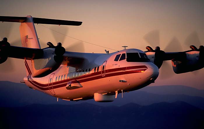 Aerial stock photography airplane stock photos RC-7B Crazy Hawk de Havilland Dash-7 DHC-7 image. The de Havilland DHC-7 is a four engine turboprop STOL airliner ideal for operating out of short runways. This airplane picture captures one of the military versions used by the US Army Airborne Reconnaissance Low (ARL-M) program called the RC-7B Crazy Hawk. It was also called EO-5C RO-5C. de Havilland Canada is no longer typically named as the builder, Bombardier is the entity. Download this high definition digital example of our de Havilland Dash-7 Stock Photos today.